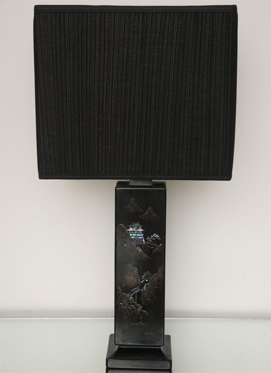 This charming pair of 50's lamps features Asian landscapes in glittery mother-of-pearl, set into shiny, black lacquer on metal. The landscape even trails around to the sides of the lamps! We think these would be so sexy in a dark Deco bedroom.