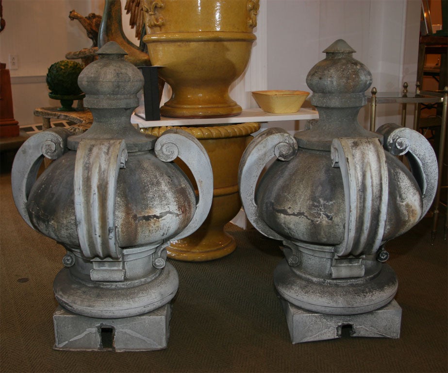 Pair of large patinated zinc finials