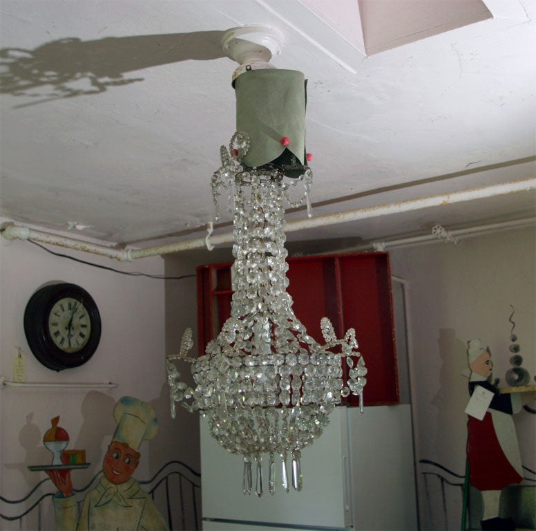 Crystal chandelier meant for sunlit garden parties. Used without candles or lights but sunlight. It can be illuminated by dropping a bulb into the center of it.