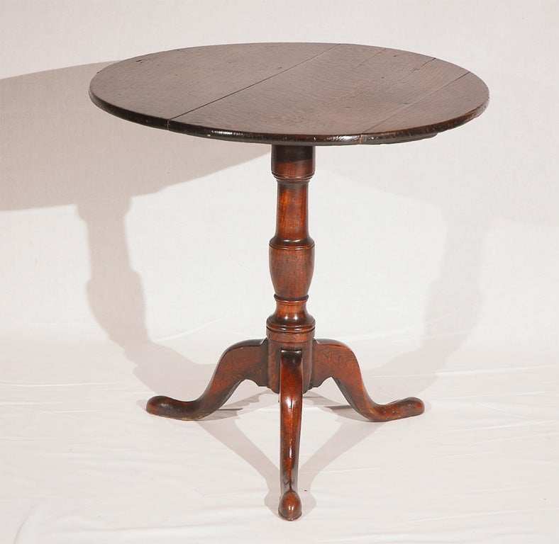English Georgian oak tilt top pedestal table.