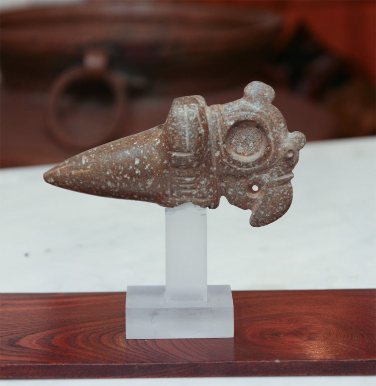 Pre Columbian ceremonial hard stone mace or axe head depicting the carved stylized head of a parrot. Late period circa 1000-1500 A.D.