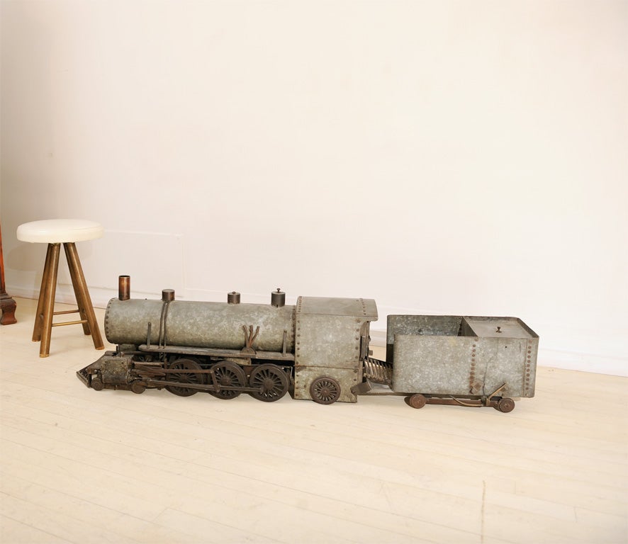 Amazing one of a kind handmade train model, constructed from zinc, iron, and copper elements.  There are movable parts and pieces, and it may have been an actual working steam operated model.  This is an incredible piece of authentic Americana. 