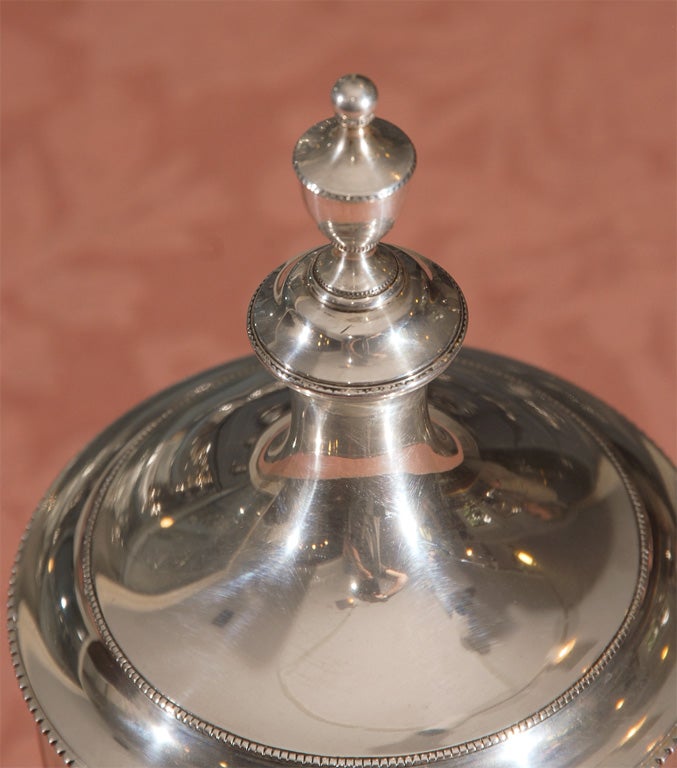A sterling container made by Tiffany & Co. between 1917 and 1945. This box is stamped on the bottom with the a statement that it is a copy  of a sugar urn made by the famed American Colonial silversmith J. Richardson of Philadelphia in the late 19th