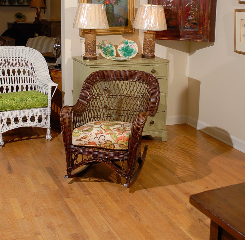 This is a fabulous example of American wicker.  The comfortable rocker is Bar Harbor style and in great shape.  The cushion is new.  The rocker was professionally restored.<br />
<br />
Please visit our website for more pieces.<br