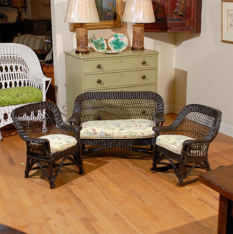 This is a rare yet adorable 3 piece child's wicker set.  There is a matching sofa, rocker and chair.  The set has been professionally restored and repainted.   The cushions are newly made.  Bar Harbor is a style of open weave wicker.<br />
The sofa