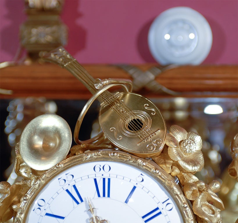 Gilt bronze musical cherubs figural clock.