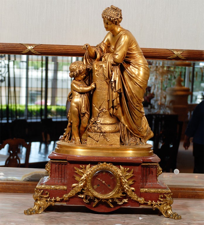 Magnificent gilt bronze clock signed Barbadienne founder, rouge Royale marble base.