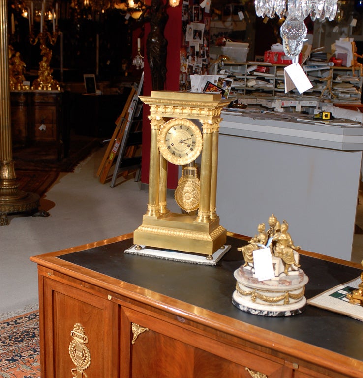 Superb gilt bronze portico clock signed M. Morer, Rue Dauphine, Paris. L Dalton signed by hand on the pendulum.