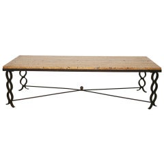 A Jean Royere Travertine and Iron Low Table