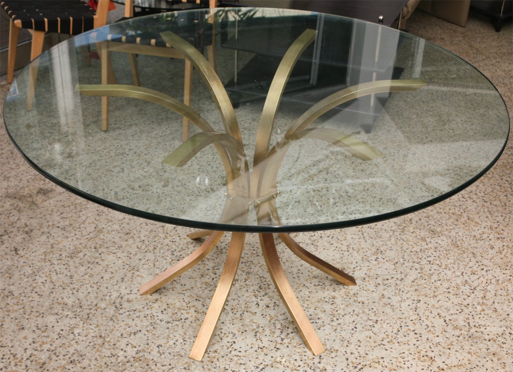 Delicate but substantial, modern but elegant, this very smart solid brass table with a brushed finish could serve equally well in a dining room or entry foyer.