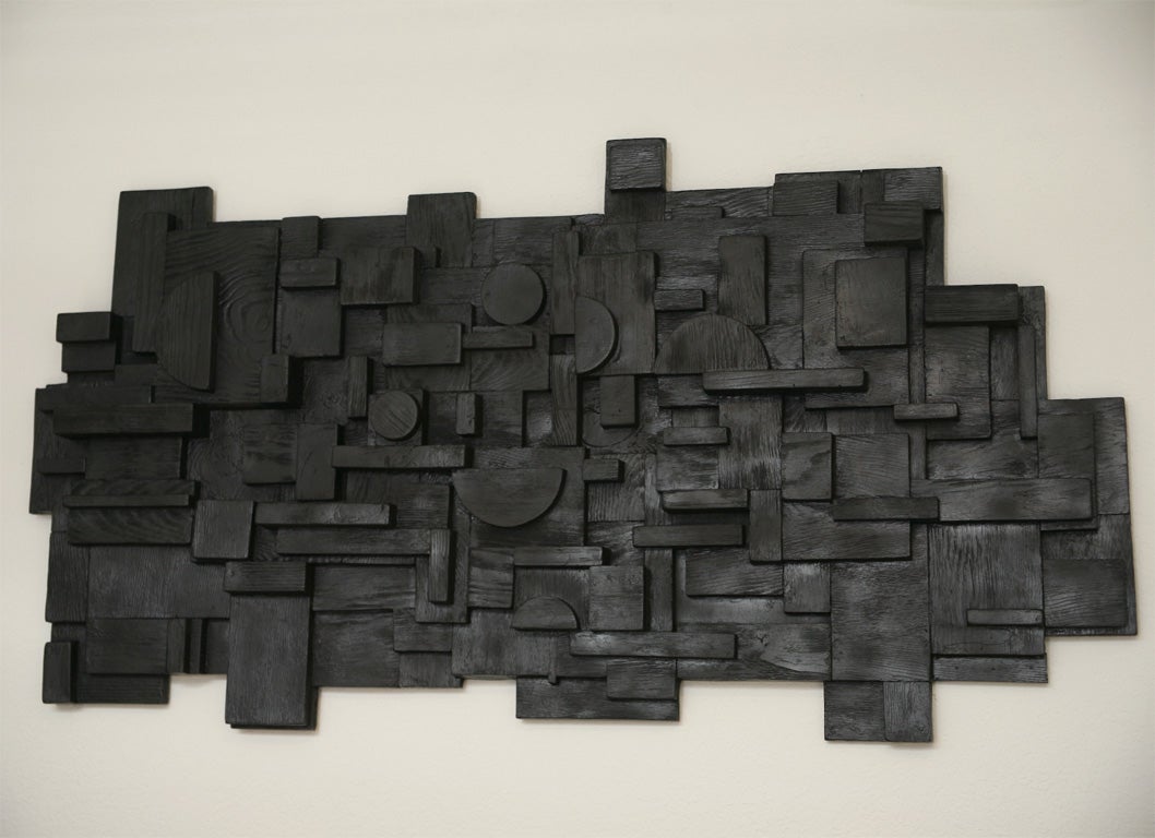 An audacious, over-scaled, wonderfully grained, fiberglas version of Louise Nevelson's iconic wood constructions.