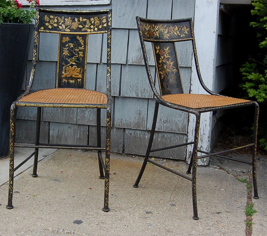 Pair of petite tole chairs with cane seats
