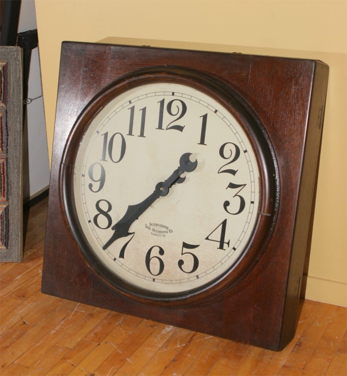 Imposing oak encased clock with bold black numerals and hands, and logo of the maker, International Time Recording Company of New York.  Endicott, N.Y.  The International Time Recording Company (ITR) began as the Bundy Manufacturing Company in