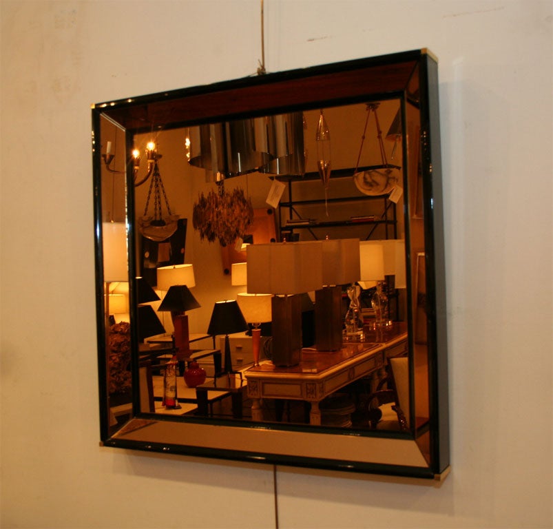 A square gold color mirror