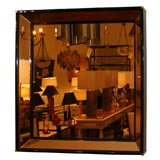 A square gold color mirror