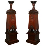 A Pair of early 19th century carved mahogany vases and pedestals
