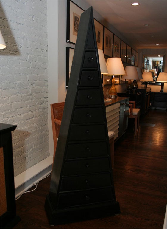 Triangular Ebonized mahogany chest of drawers with turned wood pulls