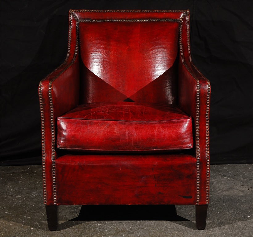 1950's flair for this armchair by Jean de Merry workshop.<br />
Walnut Feet with Brown Satin finish, Hand-tied Coil Spring Seat<br />
JDM Hand-dyed Leather and distressing