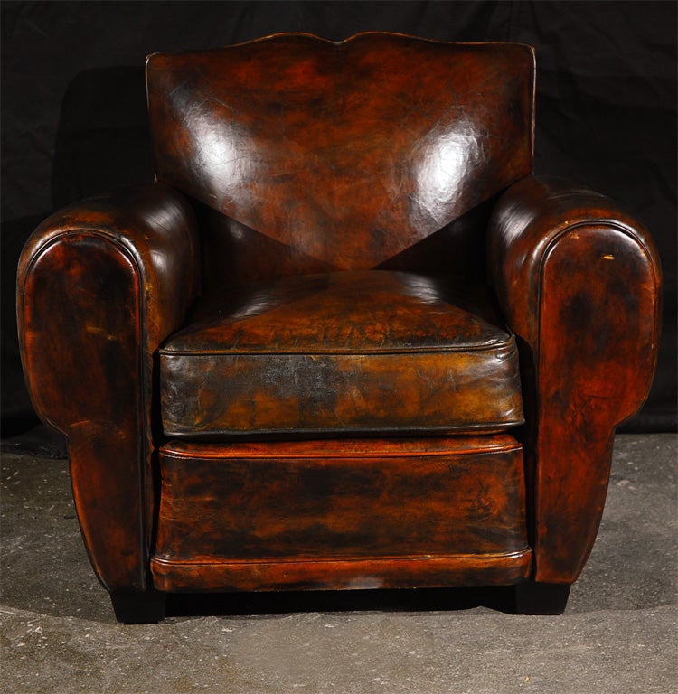1940's flair for this armchair by Jean de Merry workshop.<br />
Walnut Feet with Brown Satin finish, Hand-tied Coil Spring Seat<br />
JDM Hand-dyed Leather and distressing