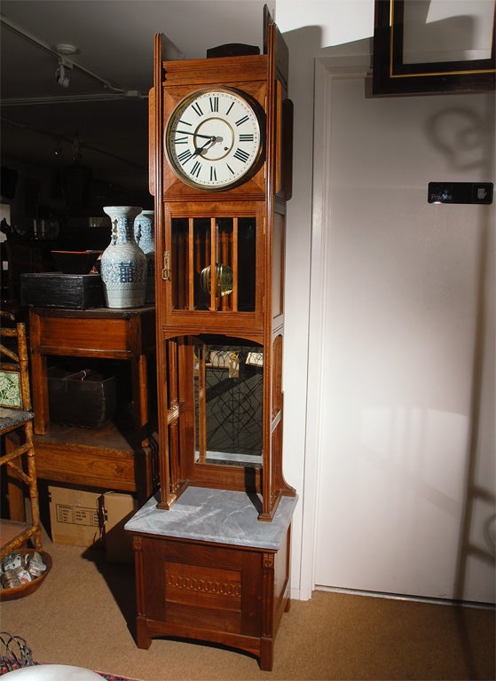 This very nice American Grandfather clock would be well suited for that special place in an arts and crafts setting as well as a delight just about anywhere else. The case is superbly crafted in walnut with fine details. The dial and movement have