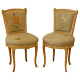 A Pair of Louis XV/ XVI Style Needlepoint Chairs