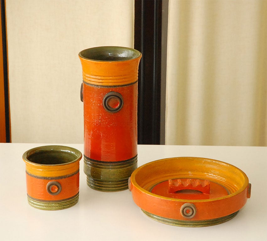3 pieces of mid century Rosenthal Netter made in Italy. A tall vase, an ash tray and a smaller vase/container. Beautiful mix of  the colors orange, green and mustard.