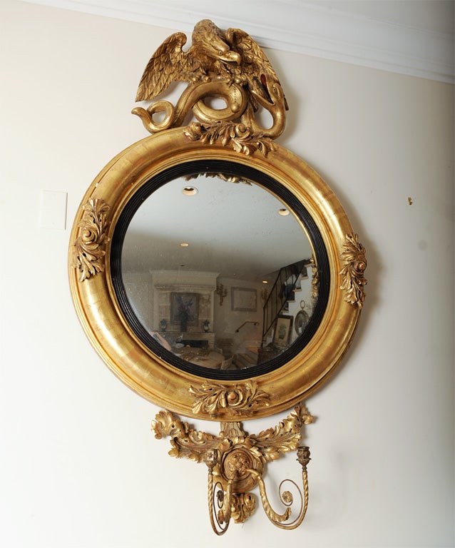 Gilt English Federal Style Dutch Convex Mirror with Eagle and Serpent decorated pediment.