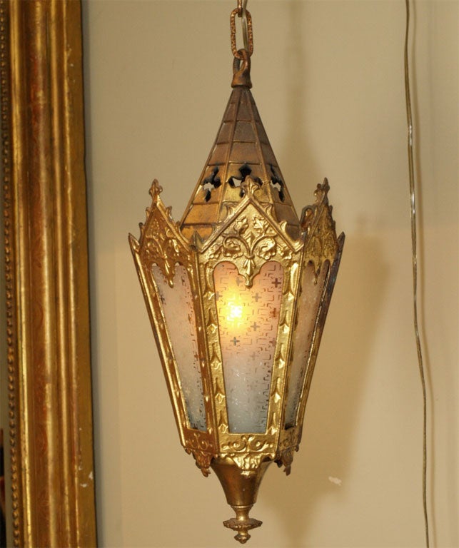 18th C  Italian Processional Lantern in gilt tole with etched glass panels.  Electrial US wiring.  3 watt interior flickering candle.  4 etched glass panels & 2 missing. Chain suspension with antique brass canopy.