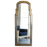 Large brass and ebony mirror with etched design.