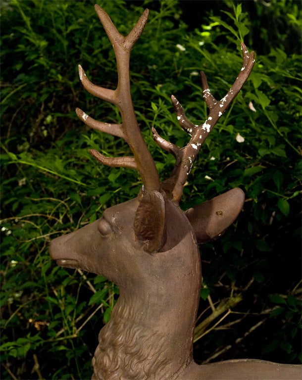 A cast-iron stag on base. The standing cast-iron deer form was a favorite garden figure in the mid-to-late-nineteenth century in America, due to its association with the romantic, pastoral gardens popularized after the 1840s by Andrew Jackson