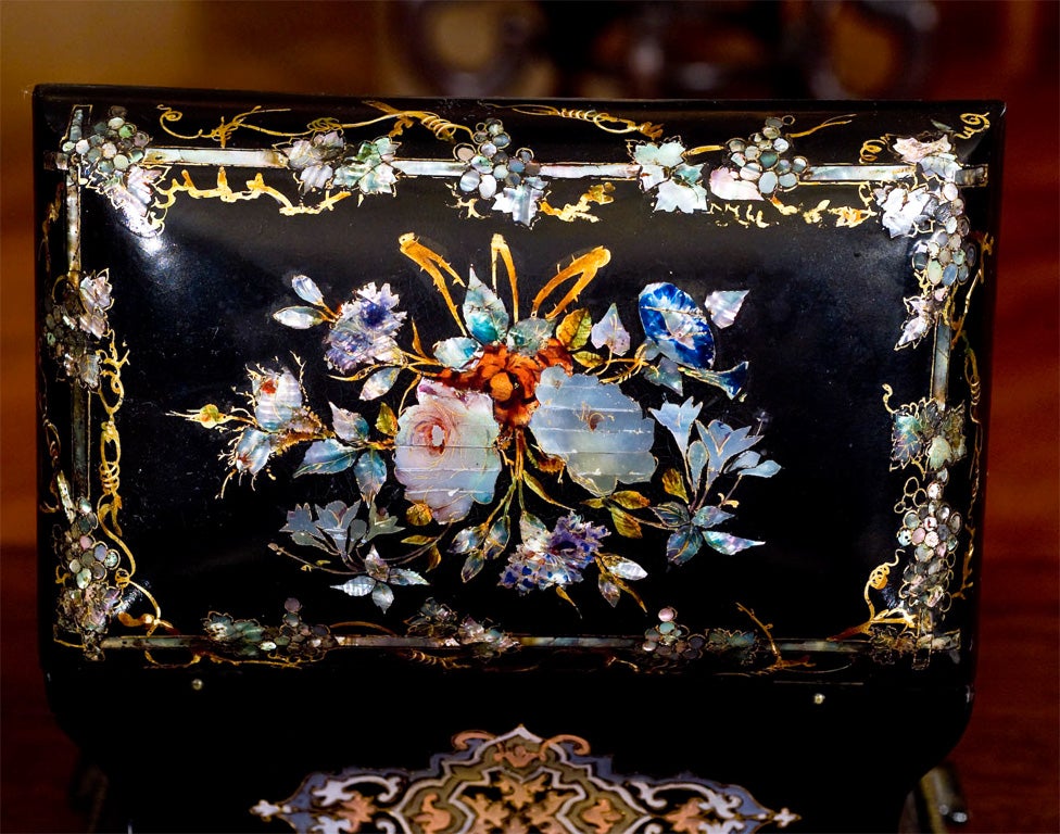 SARCOPHAGUS SHAPED WITH MOTHER OF PEARL INLAID FLORAL MOTIF.