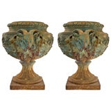 PAIR OF ORNATE CAST IRON URNS