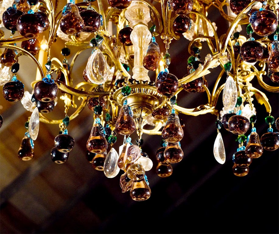 French, gilded bronze and crystal grand-scale 30-arm electrified chandelier with amethyst crystal apples and pears;<br />
20 electrified candles with 10 additional crystal spikes in the remaining cups.