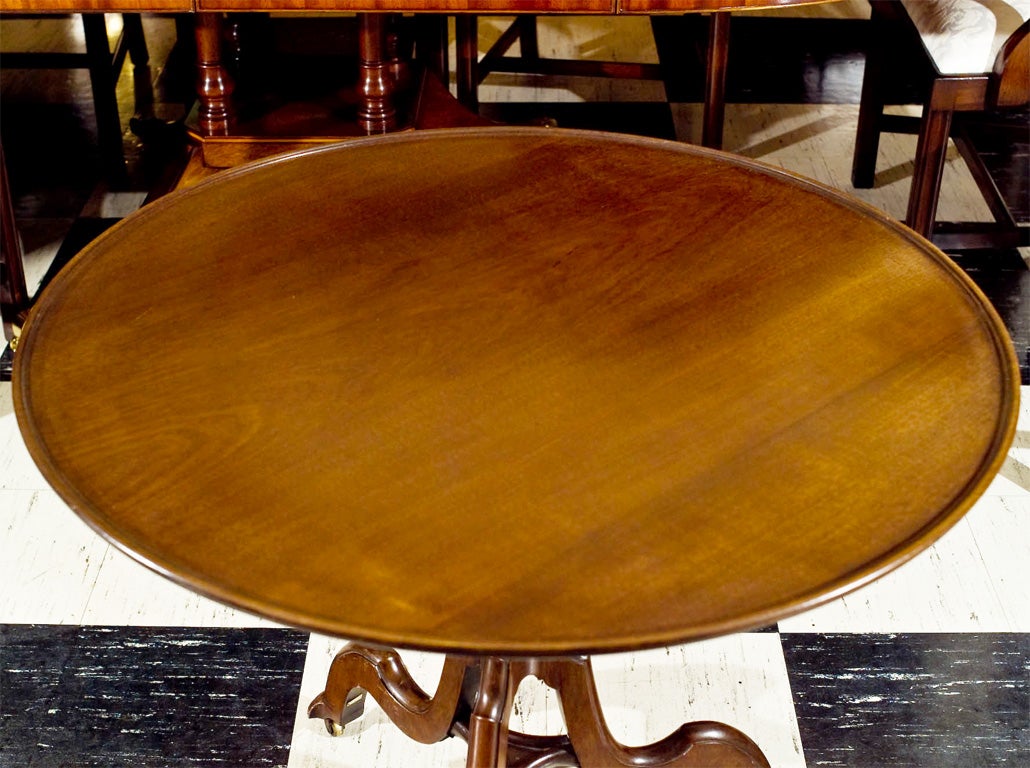 English, mahogany tripod tilt-top table with dish edge. Unique pedestal with solid stretcher defines this normally ubiquitous table as something out of the ordinary.  Further setting this table apart is the knowledge that it was commissioned by Lady