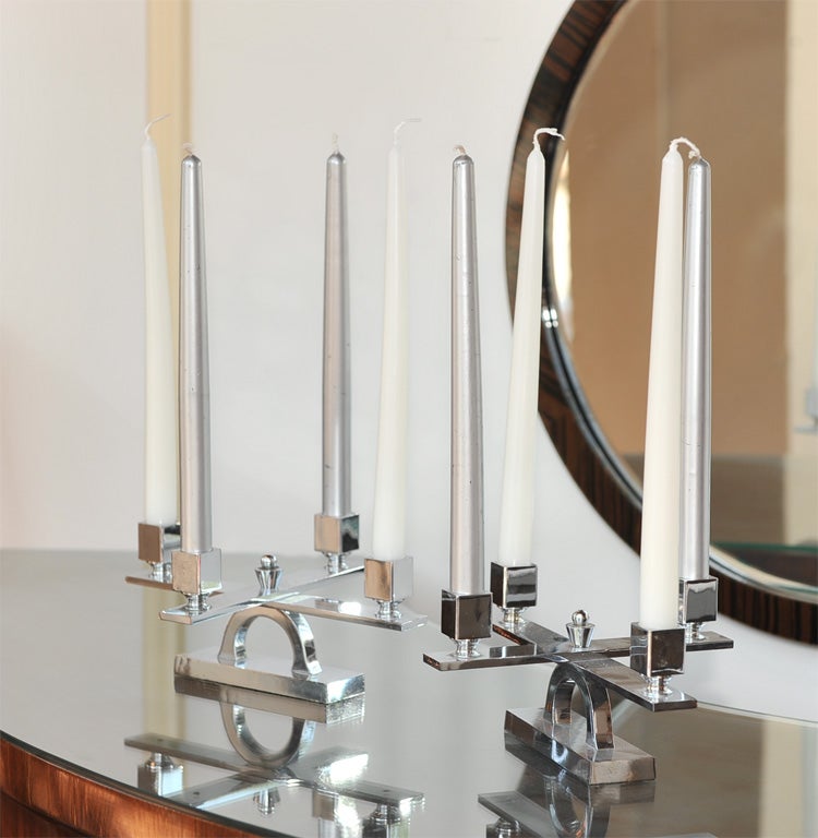 What else can I possibly say about these heavily chrome-plated brass, rare, hefty, 1930s French Art Deco candlesticks? Hmm, how about they possess an unusual low profile with a strong modernist architectural design. What's more, they look fantastic