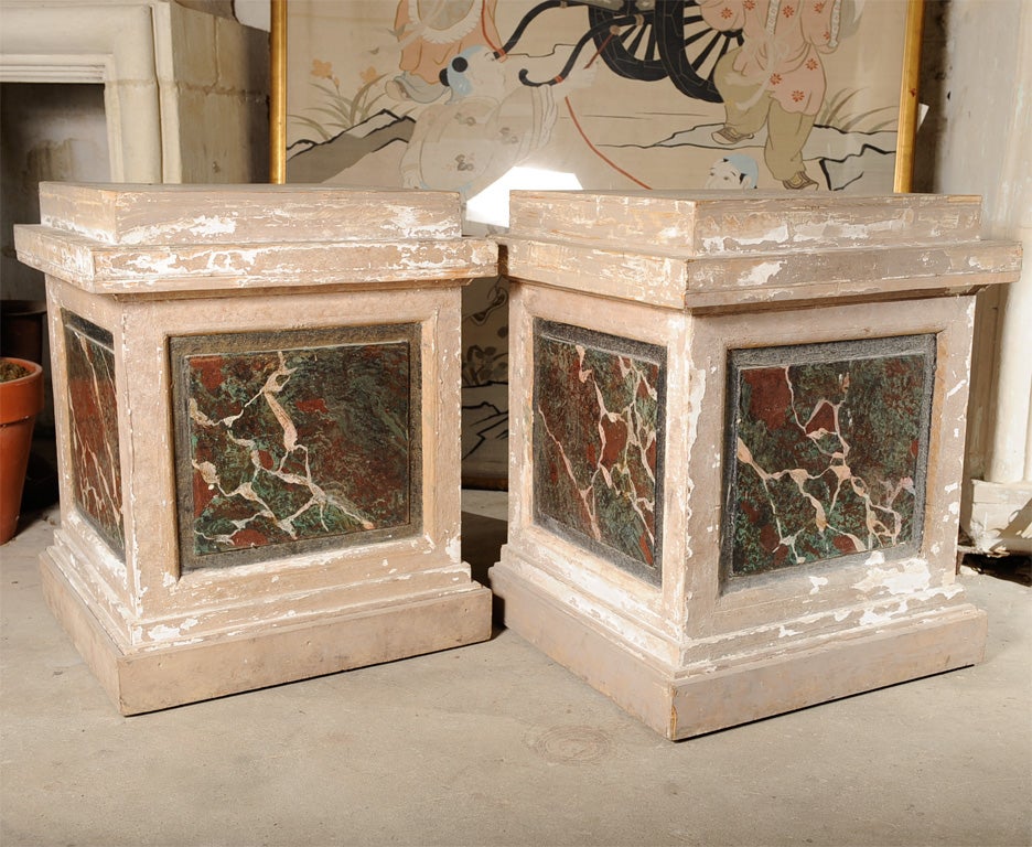Pair of French theatre pedestals, faux marble paint