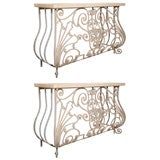 Consoles, French, wrought iron with cast stone tops