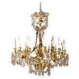 Louis XV/XVI style 18-lite bronze and crystal chandelier