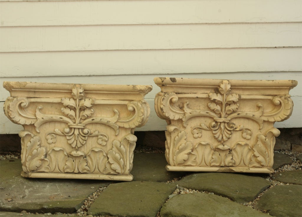 Pair of glazeed cast stone capitals