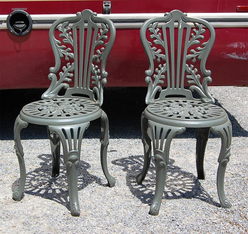 These cast iron garden chairs were from a limited production.The acorn and leaf details were revealed when the chairs were stripped and refinished. This is a comfortable casting with no protruding elements to interfere with that comfort.