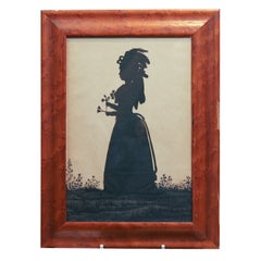 Cut Silhouette of a Young Girl with a Bouquet