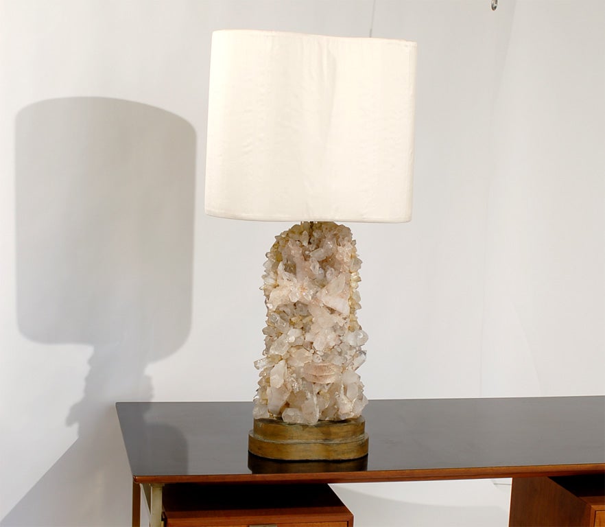 Monumental rock crystal lamp designed by Carole Stupell, circa 1960's. Independently switched up and downlights provide wonderful mood lighting, as the warm downlight gently reflects off of the rock crystals, and the uplight casts a sculptural