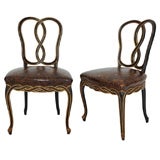 Pair of early 20th C. carved ebonized gilt Venetian side chairs