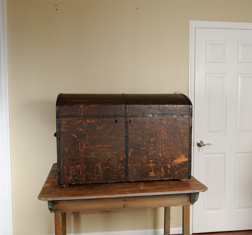 Wonderful worn Italian Immigrant's trunk.  Imagine someone's earthly possessions in this trunk traveling the seas to come to America.  Inside is lined with newspapers that date the piece to the 1890's.  Wood and leather handles make it even more