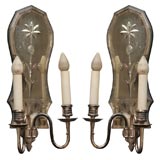 antique mirrored sconces with center floral motif
