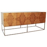 A Milo Baughman Olive Wood and Chrome Sideboard.