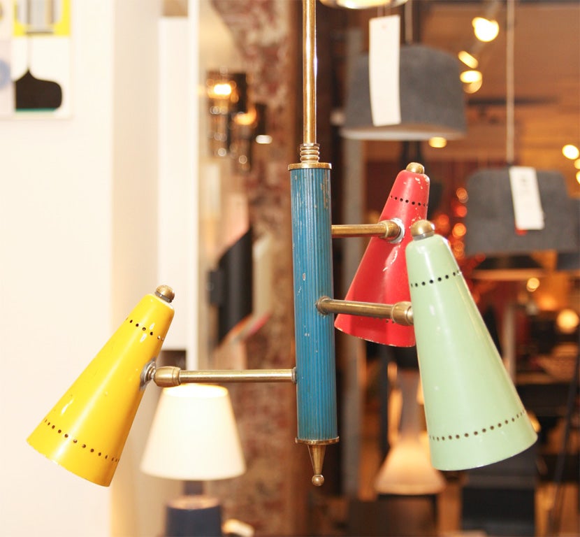 3 arm brass chandelier with different colored cones