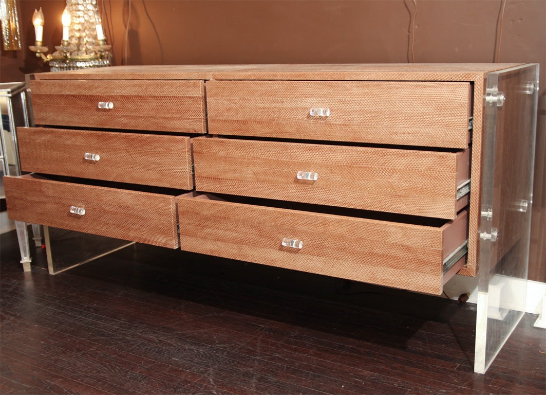 1960s six-drawer dresser with Lucite side panels and taupe snake upholstery.