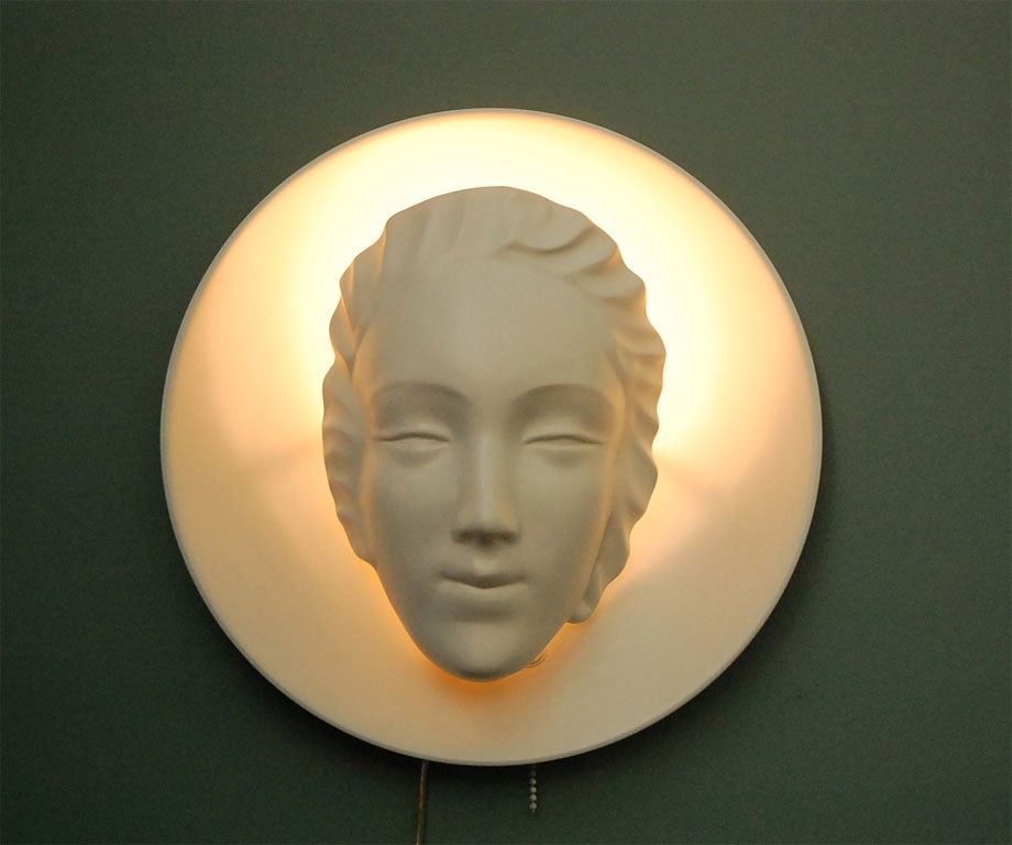 Illuminated face sconce with gesso-like finish. Rewired.