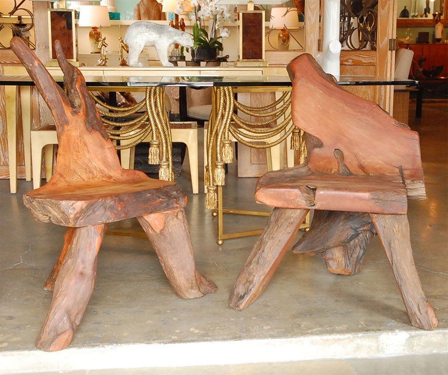 Pair of sculptural log or root chairs with a rustic vibe, hand carved by an unknown maker.